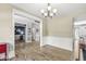 Elegant dining room with adjoining spaces and wood floors showcasing a beautiful area for hosting meals and entertaining at 9037 Carnation Dr, Noblesville, IN 46060