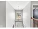 Grand foyer entrance features an elegant chandelier, staircase, and bright window creating an inviting atmosphere at 9037 Carnation Dr, Noblesville, IN 46060