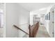 Hallway with wood railing overlooking the staircase at 9037 Carnation Dr, Noblesville, IN 46060
