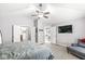A well-lit main bedroom features a ceiling fan and doorways leading to the ensuite bathroom at 9037 Carnation Dr, Noblesville, IN 46060