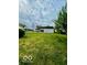Lawn with garage, offering green space and potential outdoor activities at 908 E 32Nd St, Anderson, IN 46016
