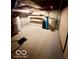 Unfinished basement area featuring concrete walls, water filtration system, and room for customization at 908 E 32Nd St, Anderson, IN 46016