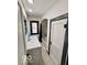 Bright bathroom showcasing a new vanity, arched shower/tub combo, and tiled floor at 908 E 32Nd St, Anderson, IN 46016