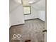 Upstairs bedroom with carpet floor and a window at 908 E 32Nd St, Anderson, IN 46016