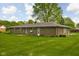 Backyard featuring a well-maintained lawn and a brick exterior of the home at 9303 Leroy Rd, Brownsburg, IN 46112