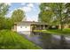 Exterior view of home showcasing brick facade, attached garage, and driveway at 9303 Leroy Rd, Brownsburg, IN 46112
