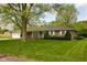 Charming brick ranch-style home with manicured lawn and attached garage at 9303 Leroy Rd, Brownsburg, IN 46112