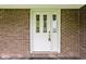 A white front door with decorative glass panels at 9303 Leroy Rd, Brownsburg, IN 46112