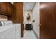 Functional laundry room with washer, dryer, and bathroom at 9303 Leroy Rd, Brownsburg, IN 46112