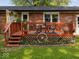 Charming backyard deck with a dining set, creating a welcoming space for outdoor gatherings and relaxation at 961 N Dellasburg Rd, Columbus, IN 47203