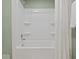 Pristine white bathtub and shower combo, offering a clean and modern bathroom space at 961 N Dellasburg Rd, Columbus, IN 47203
