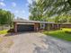 Beautiful brick home featuring a two-car garage and landscaped garden at 961 N Dellasburg Rd, Columbus, IN 47203