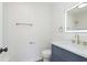 Modern bathroom with a vanity, lighted mirror, and contemporary fixtures at 10132 E 33Rd St, Indianapolis, IN 46235