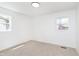 Bright bedroom with neutral carpet and two windows at 10132 E 33Rd St, Indianapolis, IN 46235