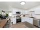 Well-equipped kitchen featuring white cabinets, stainless steel appliances, and a wood countertop at 10132 E 33Rd St, Indianapolis, IN 46235