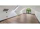 Bright attic space with skylights and a large window offering picturesque outdoor views at 10455 Courageous Dr, Indianapolis, IN 46236