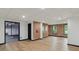 Finished basement with recessed lighting, exposed brick and a door to the exterior at 10455 Courageous Dr, Indianapolis, IN 46236