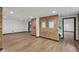 Finished basement with exposed brick and two doorways to other areas of the basement at 10455 Courageous Dr, Indianapolis, IN 46236