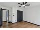 Cozy bedroom with black trim and hardware, featuring a spacious closet and modern lighting at 10455 Courageous Dr, Indianapolis, IN 46236