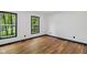 Empty bedroom with natural light streaming through large windows and sleek flooring at 10455 Courageous Dr, Indianapolis, IN 46236