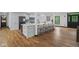 Bright and open kitchen with a large island with seating, stainless steel appliances, and modern finishes at 10455 Courageous Dr, Indianapolis, IN 46236