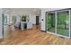 Open-concept kitchen featuring modern island, stainless steel appliances, and easy access to the outdoor deck at 10455 Courageous Dr, Indianapolis, IN 46236