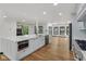 Open-concept kitchen with an island, lots of counter space and modern appliances at 10455 Courageous Dr, Indianapolis, IN 46236