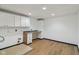 Functional laundry room with ample cabinet space and a built-in countertop at 10455 Courageous Dr, Indianapolis, IN 46236