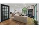 Spacious living room featuring a fireplace, large window, and comfortable seating arrangement at 10455 Courageous Dr, Indianapolis, IN 46236