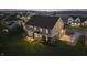 Aerial view of a home with a patio, well-kept yard, and neighborhood setting near a lake at 10599 Geist View Dr, Fishers, IN 46055