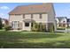 Spacious backyard with well-maintained lawn, patio area, and potential for recreational activities at 10599 Geist View Dr, Fishers, IN 46055