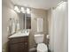 This bathroom features a vanity, toilet, mirror, and shower with a curtain at 10599 Geist View Dr, Fishers, IN 46055