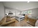Bright, spacious bedroom with multiple beds and seating area, perfect for guests at 10599 Geist View Dr, Fishers, IN 46055
