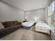 Bedroom featuring two twin beds, a couch and a window at 10599 Geist View Dr, Fishers, IN 46055