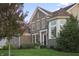 Charming two-story brick home with manicured lawn, mature landscaping, and inviting front entrance at 10599 Geist View Dr, Fishers, IN 46055