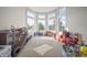 Bright playroom with a large window, storage cabinets, and plenty of room for activities at 10599 Geist View Dr, Fishers, IN 46055