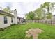 Expansive backyard featuring a well-maintained lawn and a seating area for outdoor enjoyment and gatherings at 10688 Ashview Dr, Fishers, IN 46038