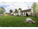 A scenic backyard featuring a wood deck and outdoor seating, ideal for relaxing and enjoying the greenery at 10688 Ashview Dr, Fishers, IN 46038