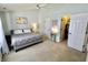 Bright bedroom boasts neutral walls, a ceiling fan, and a walk-in closet at 10688 Ashview Dr, Fishers, IN 46038
