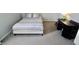 Bedroom with a plush bed, carpet flooring, and a classic black nightstand topped with a green lamp at 10688 Ashview Dr, Fishers, IN 46038