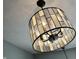 Stylish chandelier featuring a geometric shade, providing a focal point and elegant lighting to elevate any room's decor at 10688 Ashview Dr, Fishers, IN 46038