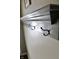 Gray painted coat rack with black hooks is mounted on the wall providing a stylish and functional storage solution at 10688 Ashview Dr, Fishers, IN 46038