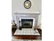 Charming fireplace with a gray mantel and tile surround, adding character and warmth to the living space at 10688 Ashview Dr, Fishers, IN 46038