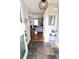 Inviting foyer with slate flooring, an eye-catching pendant light, and a view into the cozy living room at 10688 Ashview Dr, Fishers, IN 46038