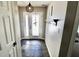 Inviting foyer with slate flooring, a coat rack, and natural light coming in through the front door at 10688 Ashview Dr, Fishers, IN 46038