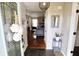 Inviting foyer with slate flooring, an eye-catching pendant light, and a view into the cozy living room at 10688 Ashview Dr, Fishers, IN 46038