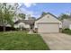Charming single-story home with a two-car garage, well-maintained lawn, and lovely landscaping at 10688 Ashview Dr, Fishers, IN 46038