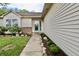 Charming single-story home with a well-manicured lawn, rock garden, and a beautiful blue front door at 10688 Ashview Dr, Fishers, IN 46038