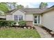 Charming single-story home with a well-manicured lawn, rock garden, and a beautiful blue front door at 10688 Ashview Dr, Fishers, IN 46038