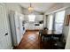 Inviting kitchen with white cabinets, stainless steel appliances, and a dining area, creating a functional and stylish space at 10688 Ashview Dr, Fishers, IN 46038
